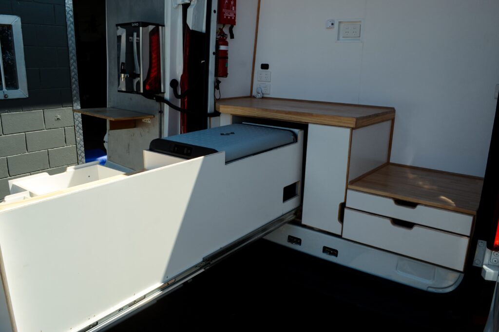 4 Voices Mobile Office Fitout - Revanped Custom Van Conversions Sunshine Coast - Rear Sliding Kitchen Drawer with Chest Fridge, Coffee Machine & Dispenser